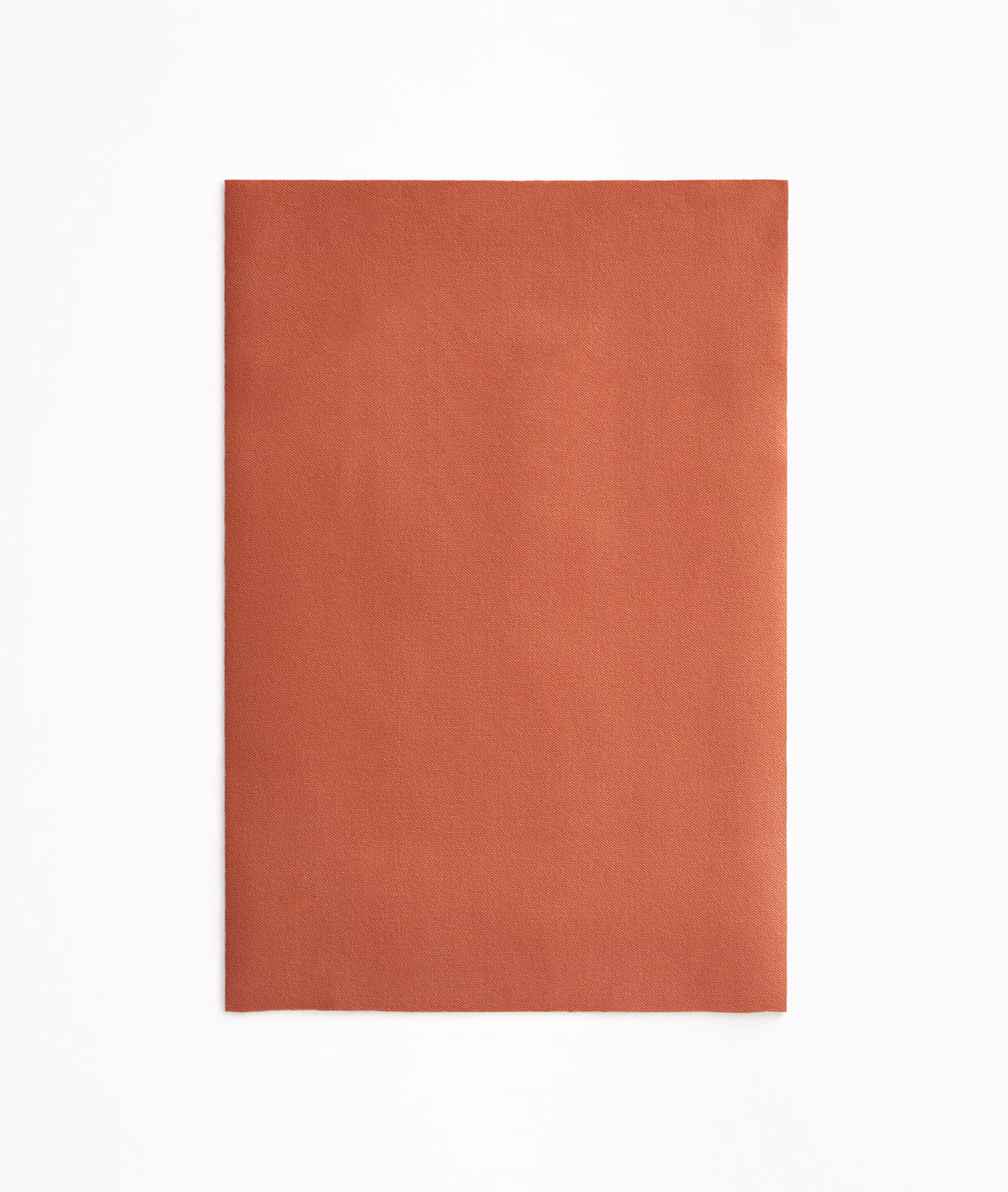 Warm coral-terracotta velvet swatch with a softly brushed, plain surface
