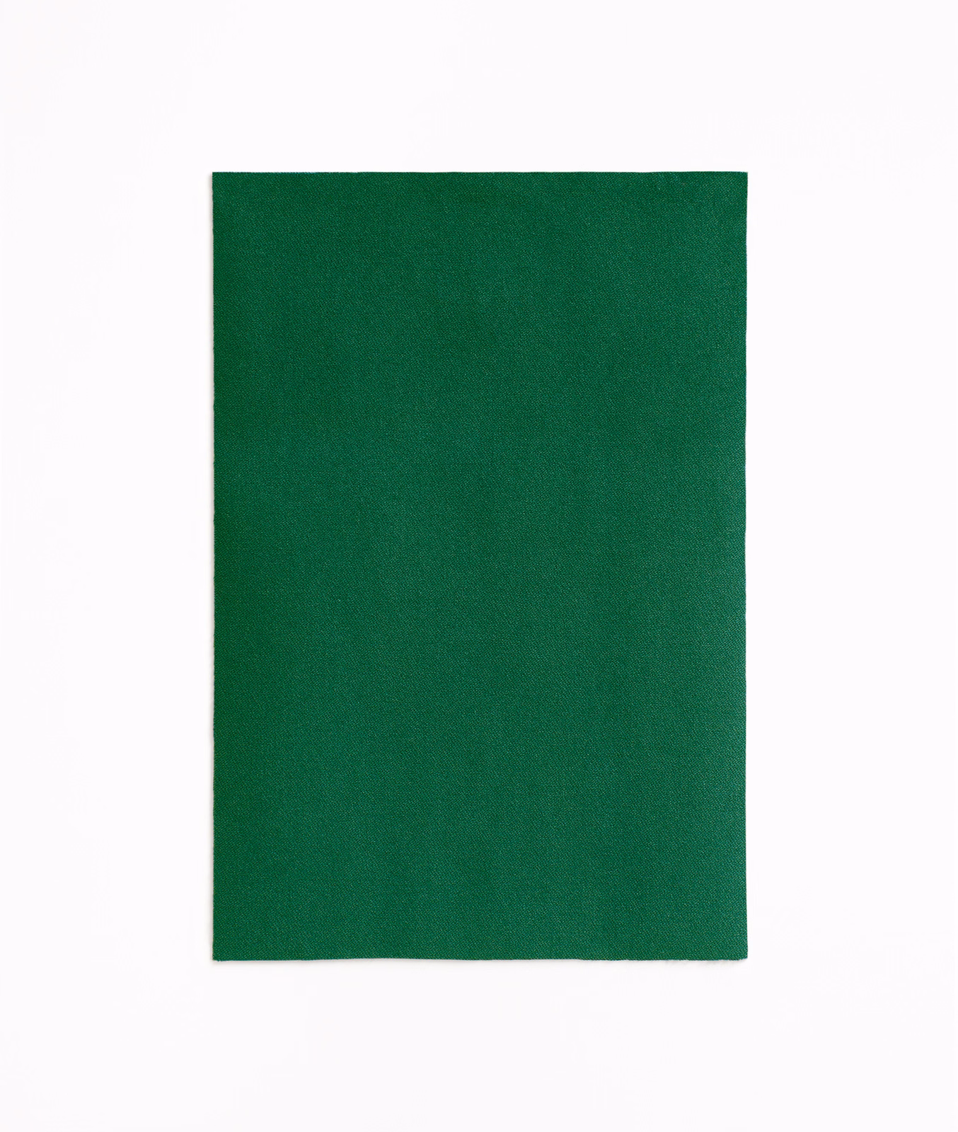 Deep emerald-green velvet swatch with a subtly shifting, smooth nap