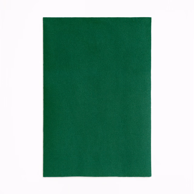 Deep emerald-green velvet swatch with a subtly shifting, smooth nap