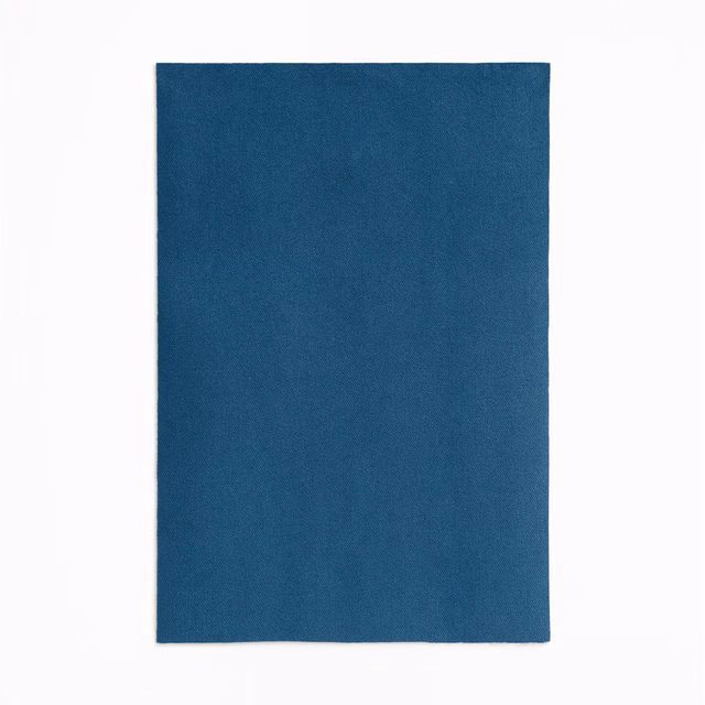 Deep indigo-blue velvet swatch showing a subtle directional nap