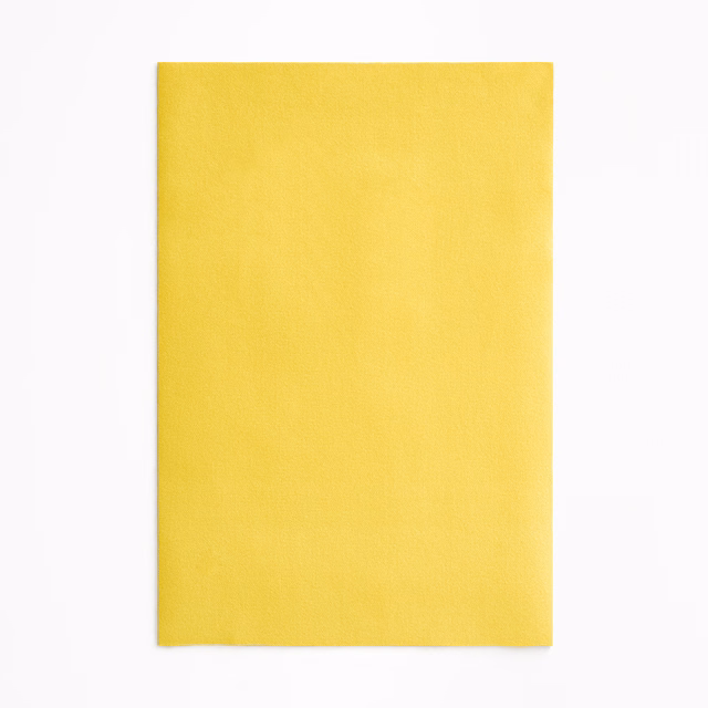 Vivid lemon-yellow velvet swatch with a soft, subtly directional nap