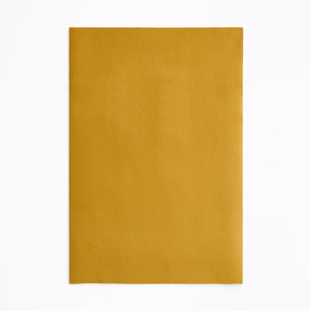 Plain mustard-yellow velvet swatch with softly shifting golden pile