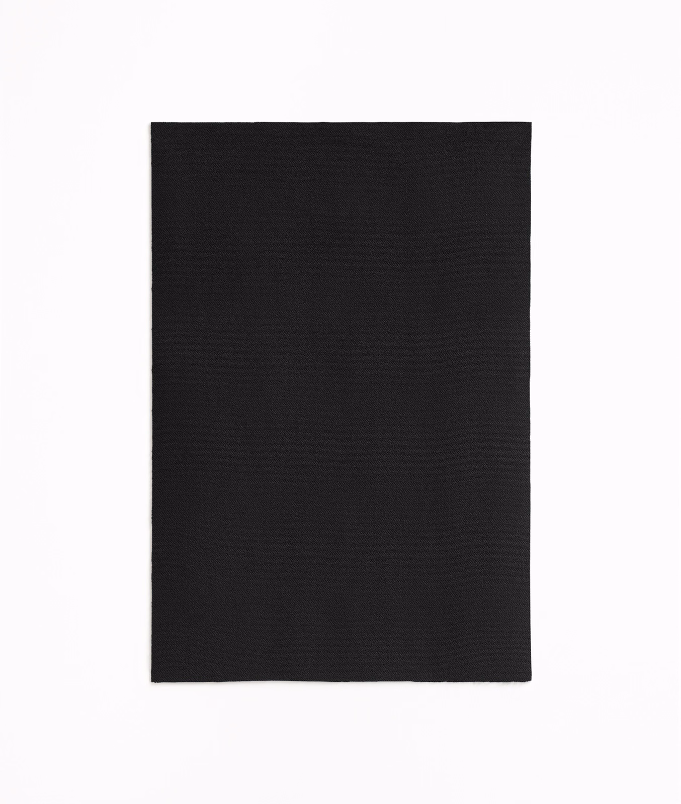 Near-black velvet swatch showing a fine directional nap and softly shifting surface