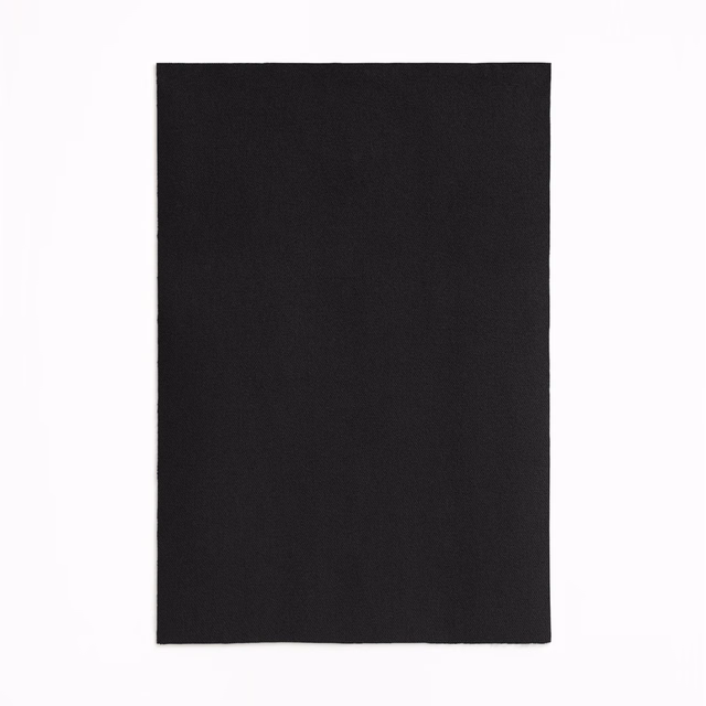 Near-black velvet swatch showing a fine directional nap and softly shifting surface