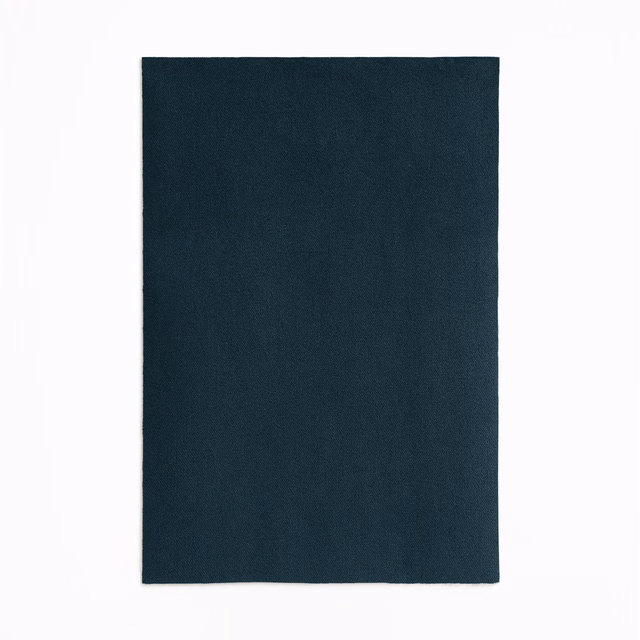 Deep blue-teal velvet swatch with a subtly shifting nap and near-black tonal depth