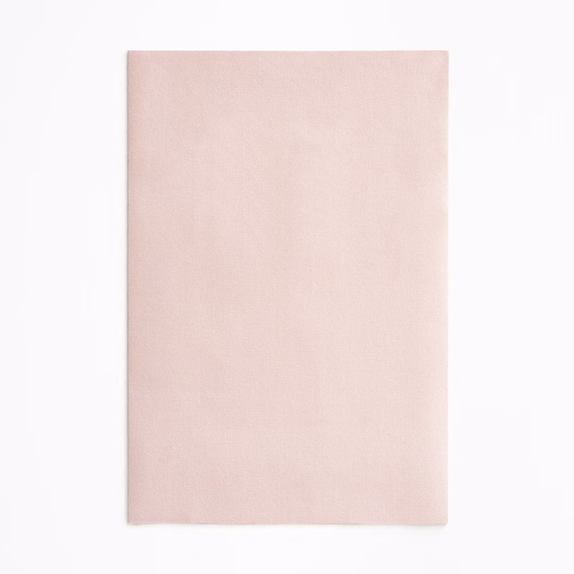 Soft blush pink velvet swatch showing a smooth, subtly shaded nap