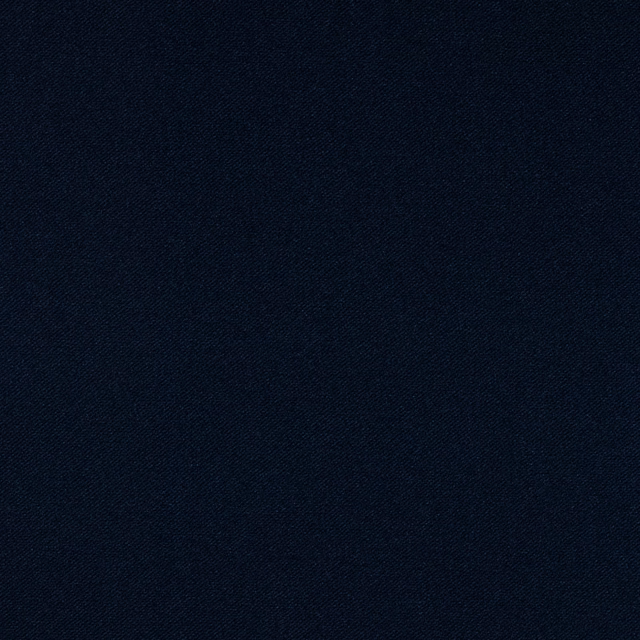 Close-up of dark Prussian-blue velvet with a fine directional, subtly textured surface