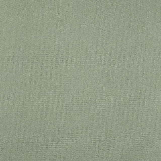 Muted celadon green velvet swatch with a fine, softly mottled texture