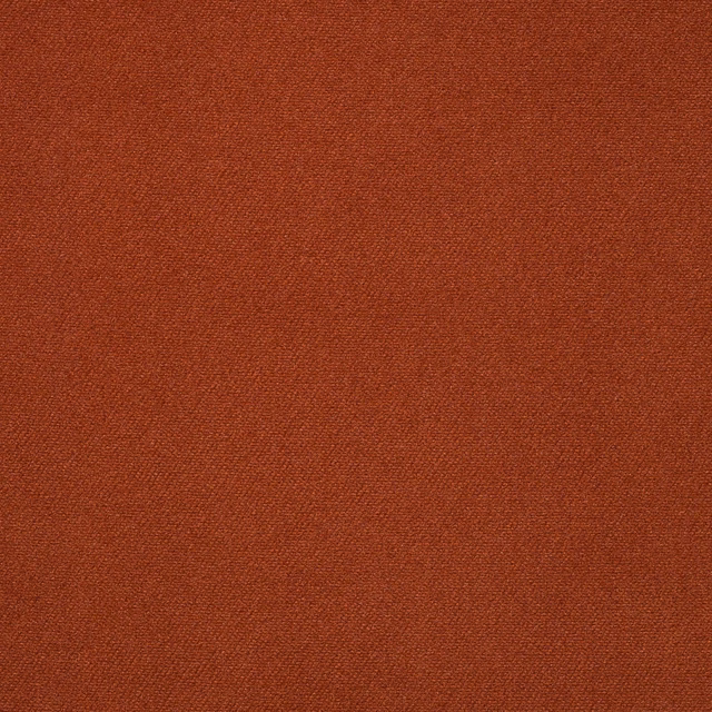 Deep rust-saffron velvet showing a fine even pile and restrained surface sheen