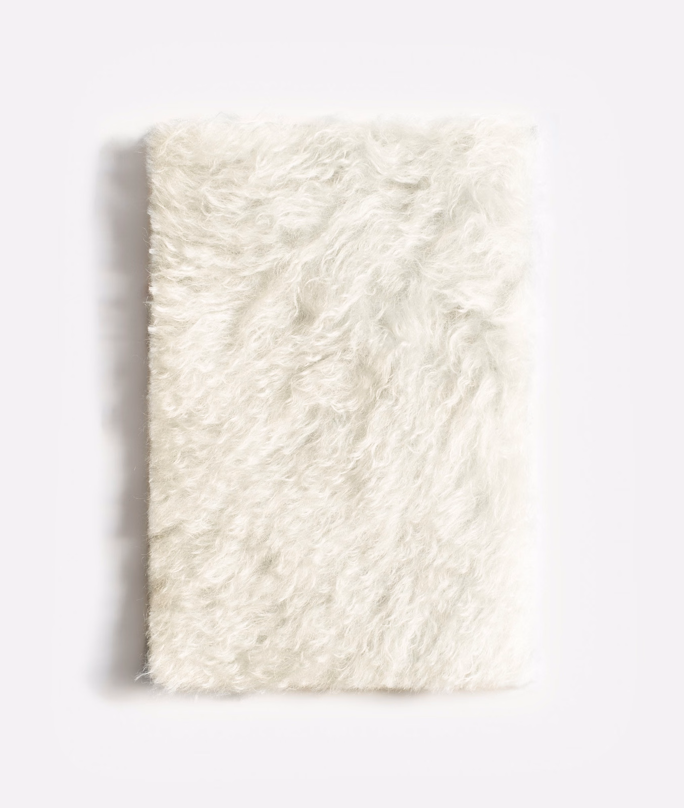Soft ivory shaggy velvet with long tousled pile and creamy highlights