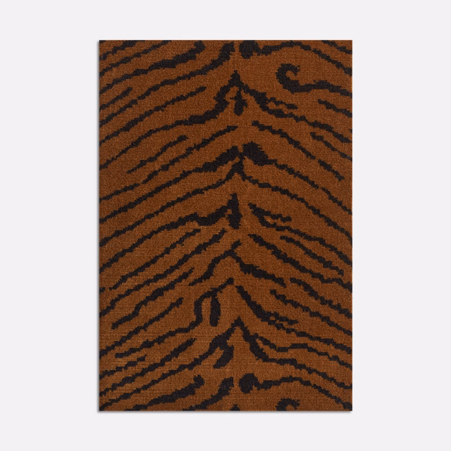 Burnt umber velvet with bold black tiger stripes and a soft directional sheen