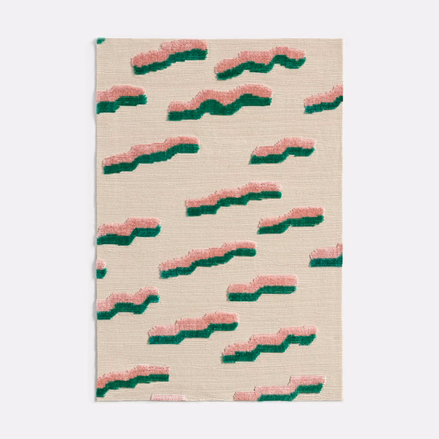 Warm ivory velvet with repeating blush-pink and green undulating woven motifs