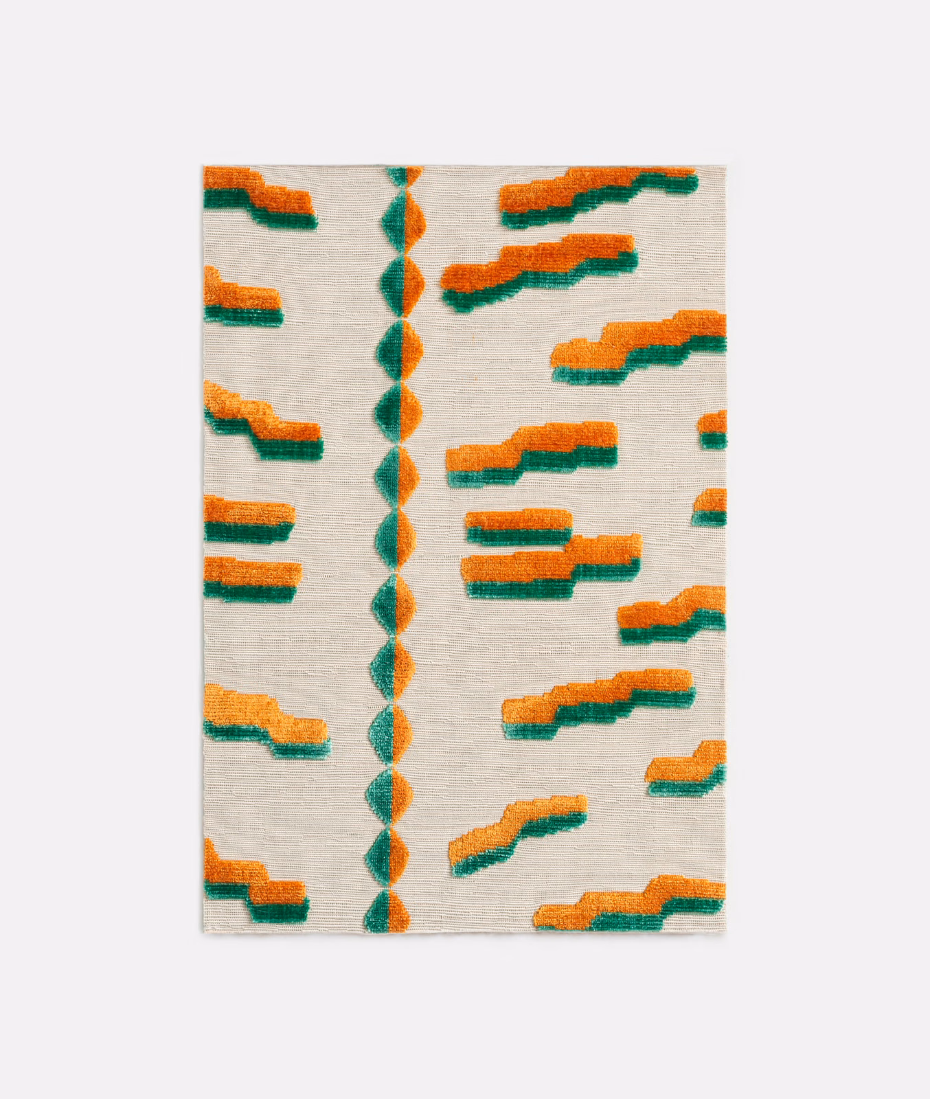 Papaya-orange and green stepped motifs on an ivory textured velvet ground