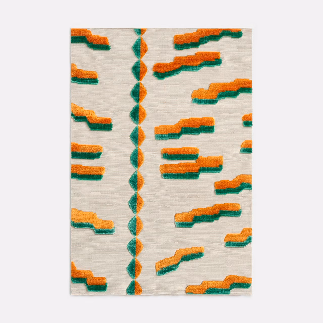 Papaya-orange and green stepped motifs on an ivory textured velvet ground