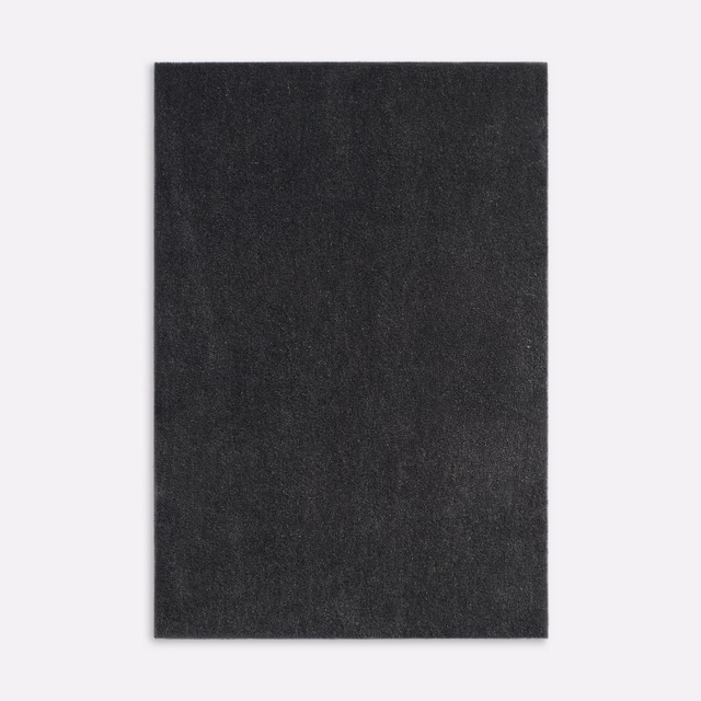 Deep charcoal grey velvet swatch with a subtly mottled brushed nap and plain surface