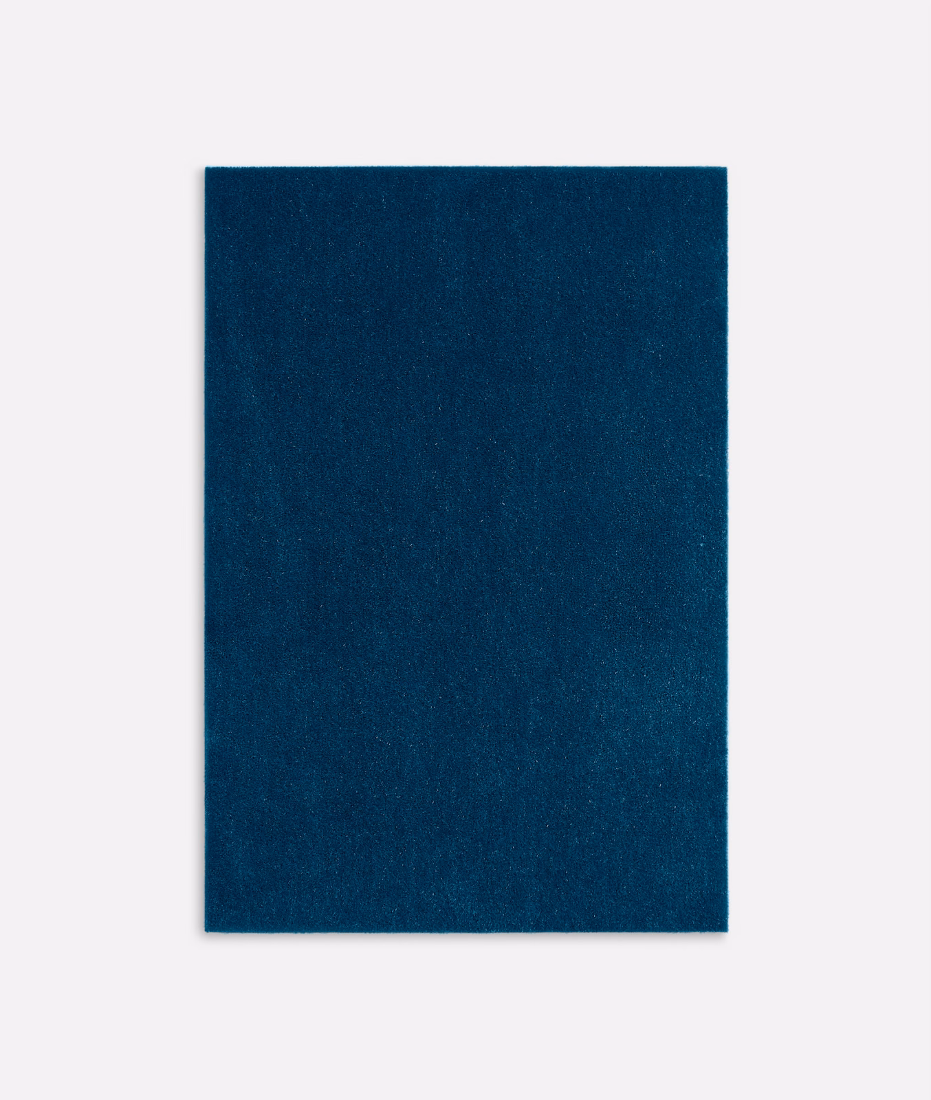 Deep denim-blue velvet swatch showing a plain face and subtle shifting pile
