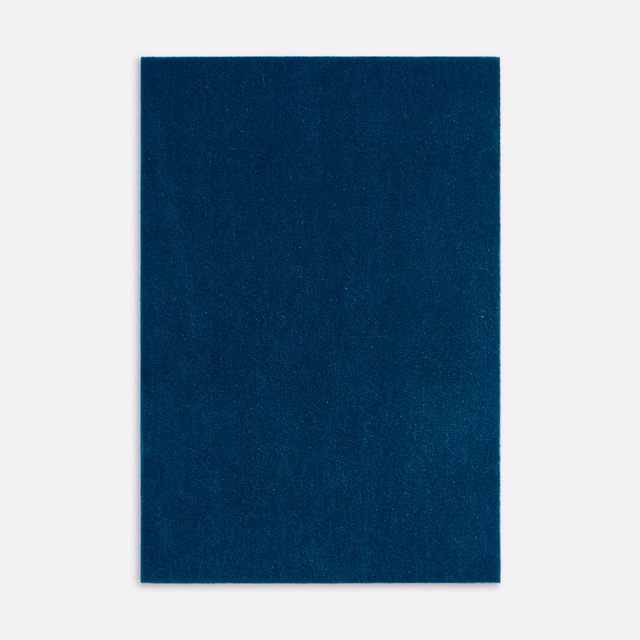 Deep denim-blue velvet swatch showing a plain face and subtle shifting pile