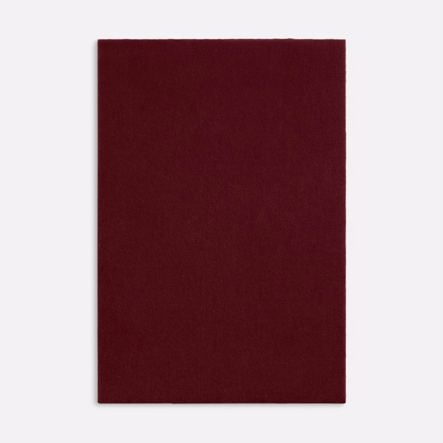 Deep bordeaux velvet swatch with a plain, softly directional pile
