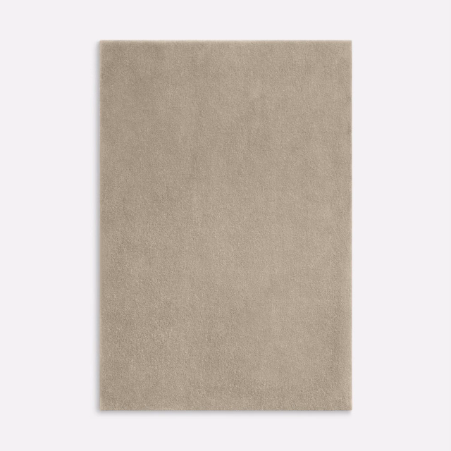 Warm stone-taupe velvet with a softly brushed, subtly mottled pile