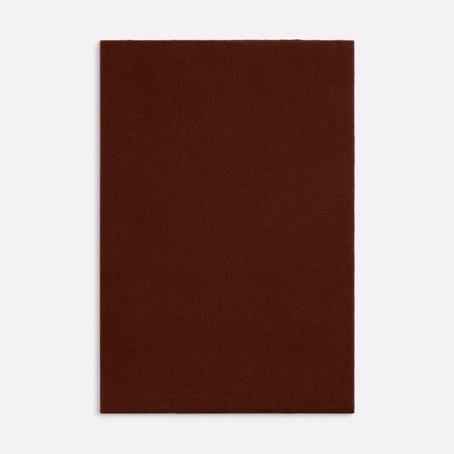 Deep oxblood-brown velvet with a dense, subtly light-catching plain pile
