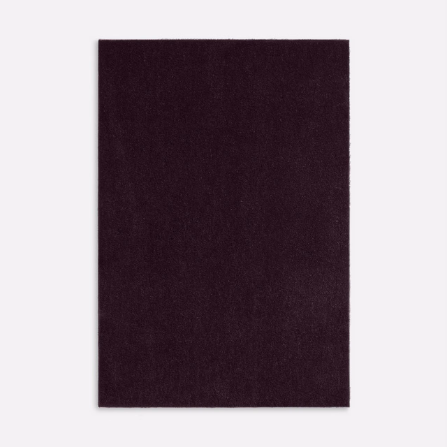 Deep aubergine-plum velvet swatch with a dense, subtly shifting pile