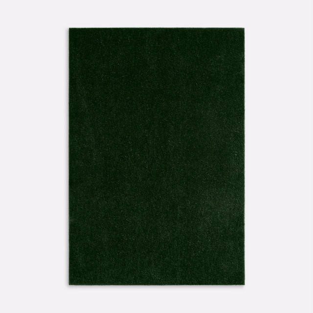 Deep bottle-green velvet swatch showing a dense, subtly varied directional pile