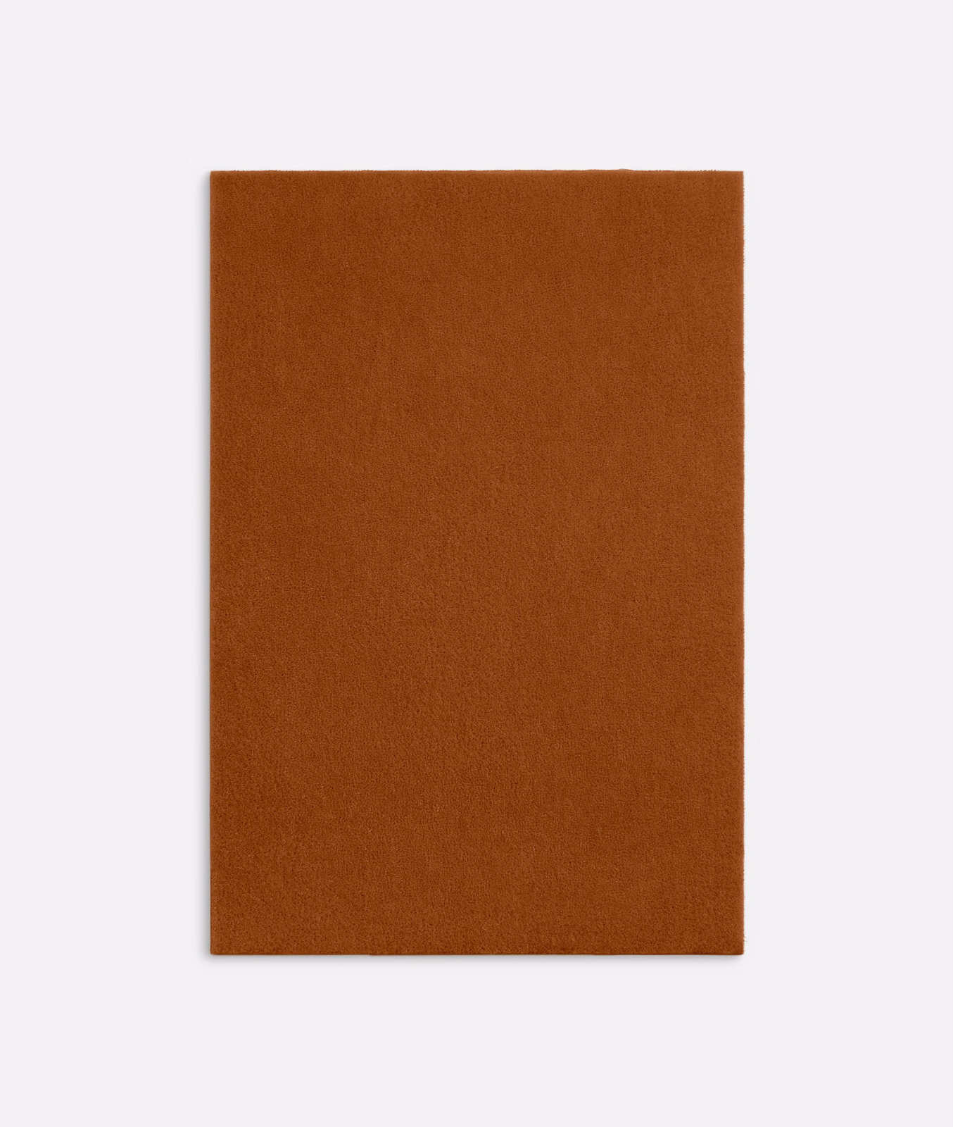 Close view of rust-brown velvet with a soft, even brushed nap