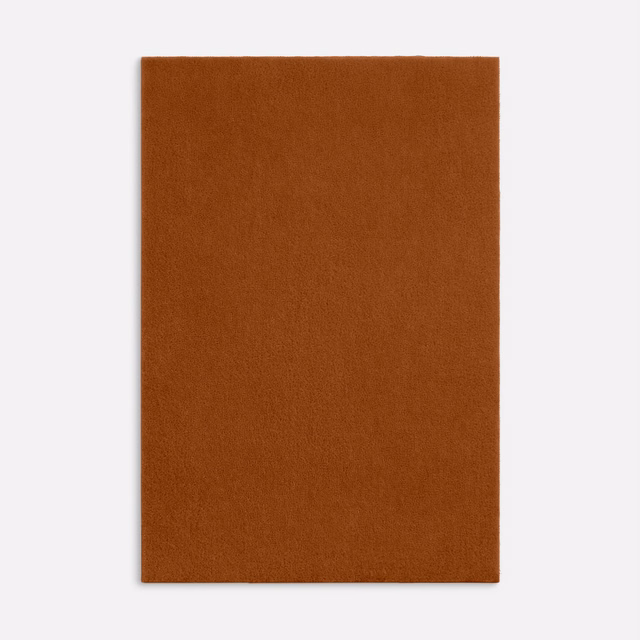 Close view of rust-brown velvet with a soft, even brushed nap