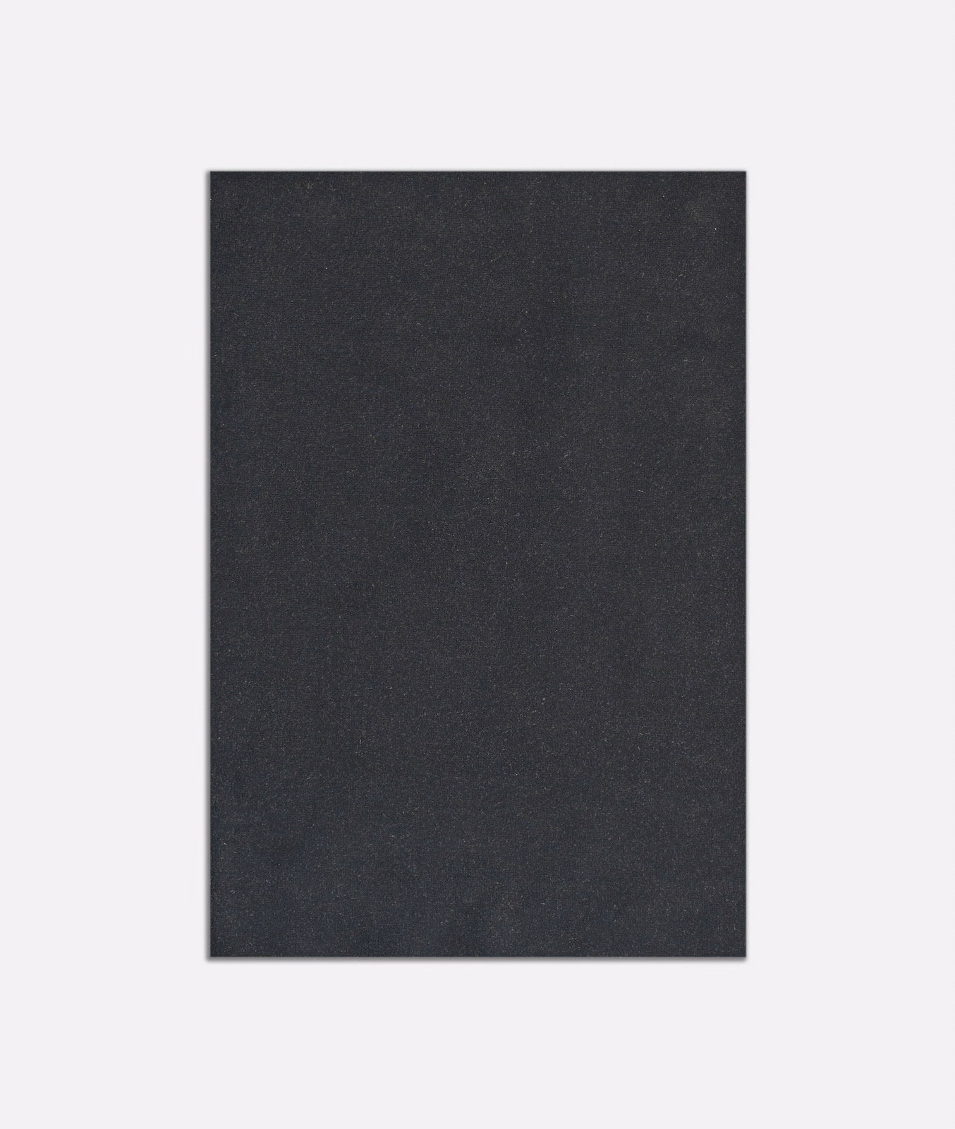 Close view of plain deep anthracite velvet with subtle directional nap and charcoal shading
