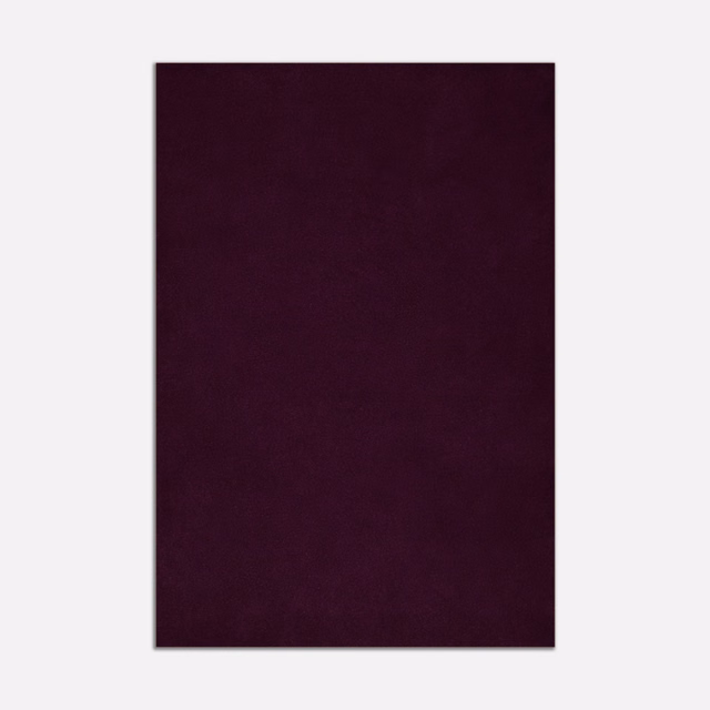 Deep aubergine-plum velvet swatch showing a soft, subtly directional nap