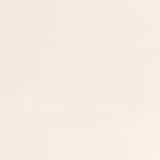 Soft ivory wallpaper with barely visible horizontal grain and a subtly textured surface