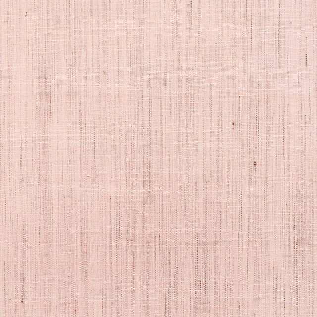 Soft blush-pink wallpaper with fine irregular vertical striations and subtle woven-looking texture