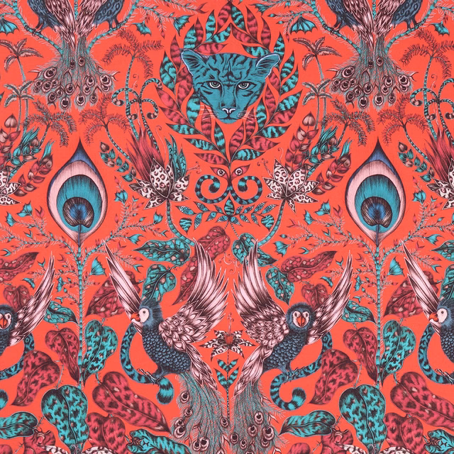 Vivid coral-red fabric with turquoise leopard, peacocks, birds and scrolling foliage
