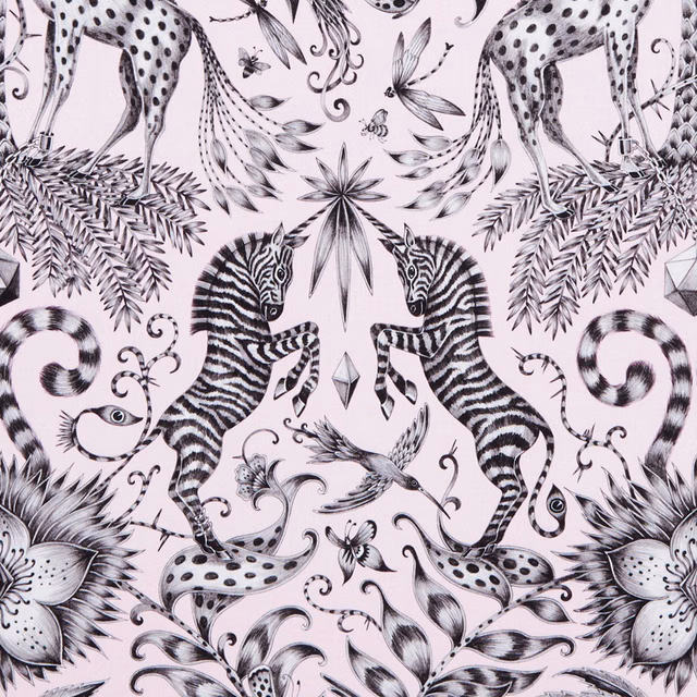 Pale blush-pink fabric with black zebras, spotted cats, birds and curling botanical motifs