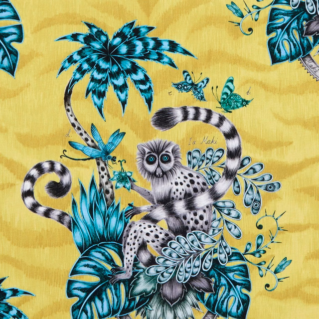 Lime-yellow fabric with a ring-tailed lemur, turquoise foliage and butterflies