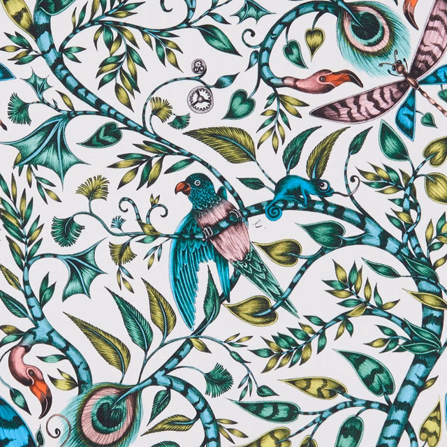 Turquoise birds and curling teal foliage on an ivory printed fabric ground