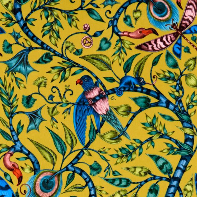 Chartreuse velvet with blue branches, jewel-toned birds and curling exotic animal motifs
