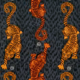 Flame-orange tigers and curling striped tails on a charcoal textured velvet ground