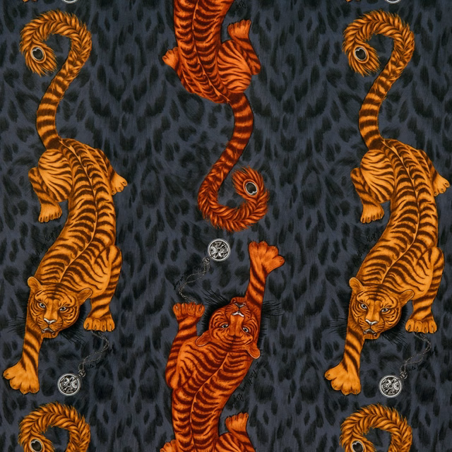 Flame-orange tigers and curling striped tails on a charcoal textured velvet ground