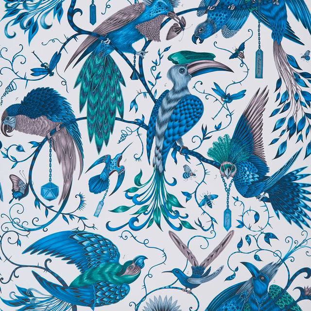 Cobalt and turquoise exotic birds among curling vines on a pale wallpaper ground