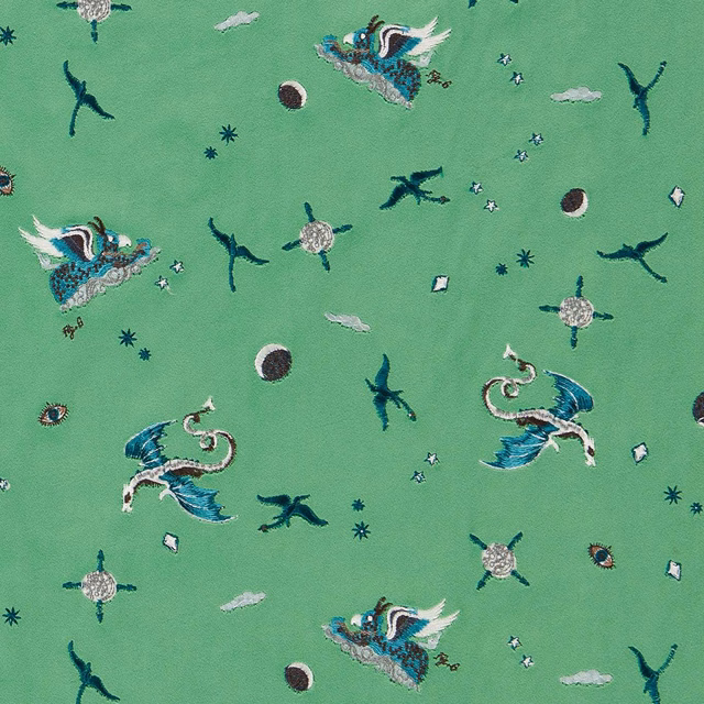 Jade green embroidered fabric with winged creatures, birds, moons and stars