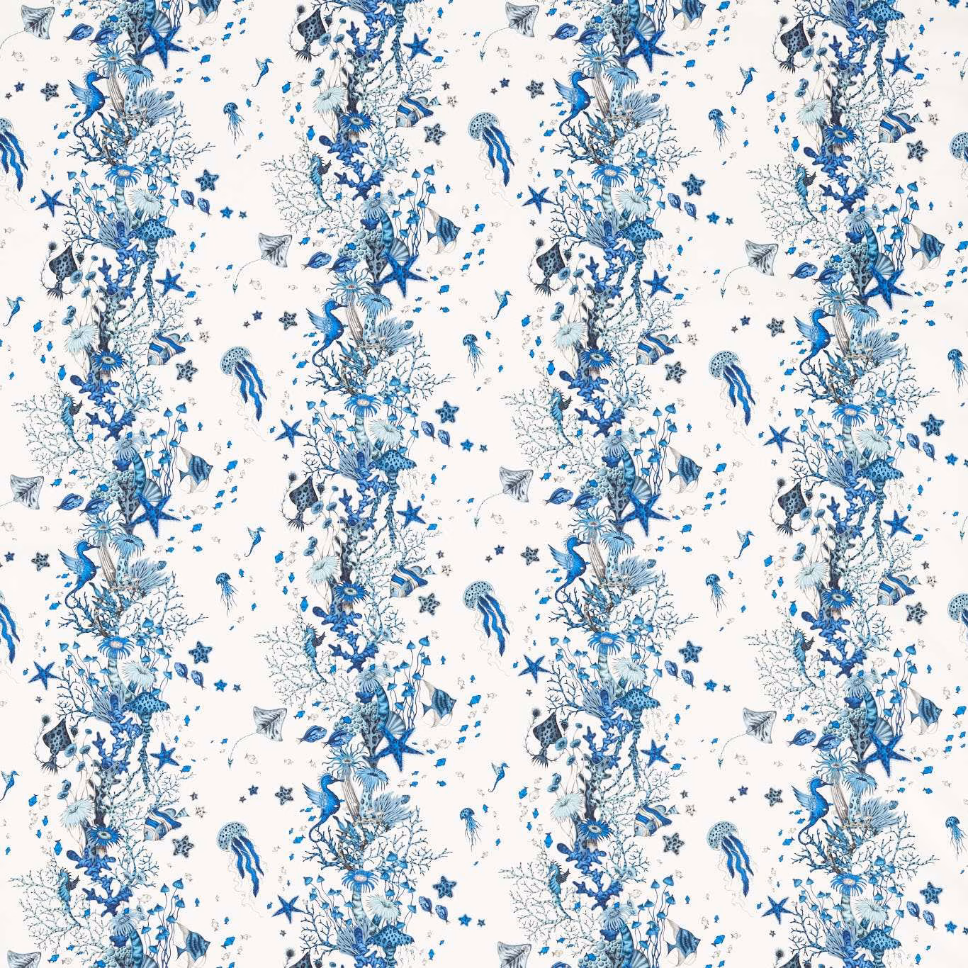 Cool blue coral, fish and starfish pattern on an ivory textile ground