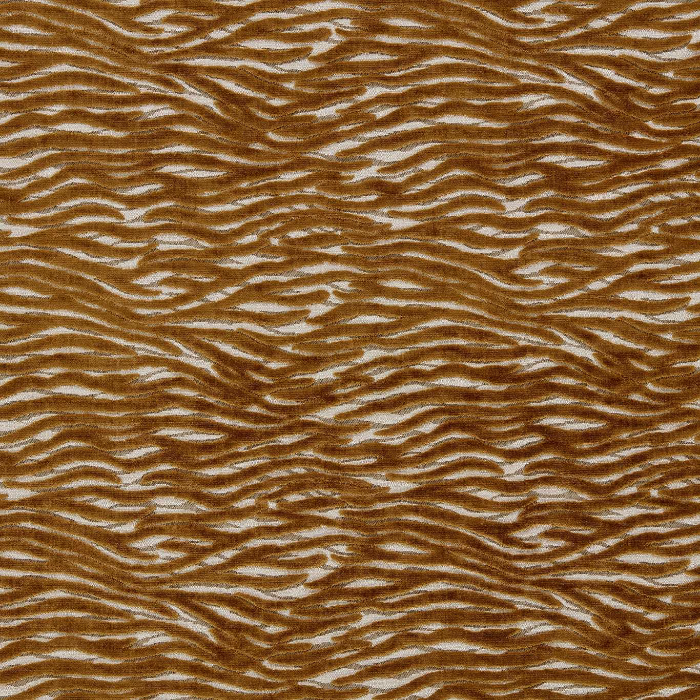 Close-up of warm bronze-brown irregular tiger stripes woven over a pale ground