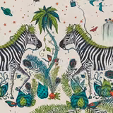 Ivory fabric showing green zebras, teal peacocks, palms and botanical jungle motifs