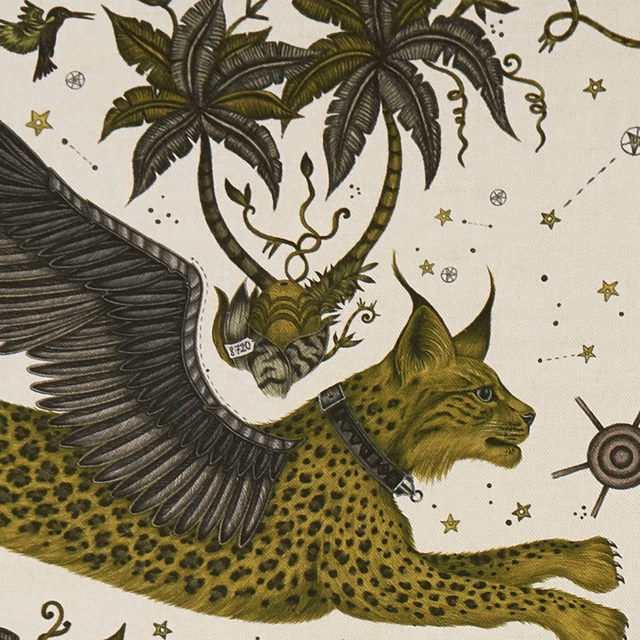 Warm ivory fabric with a muted-gold, olive spotted lynx and black wing
