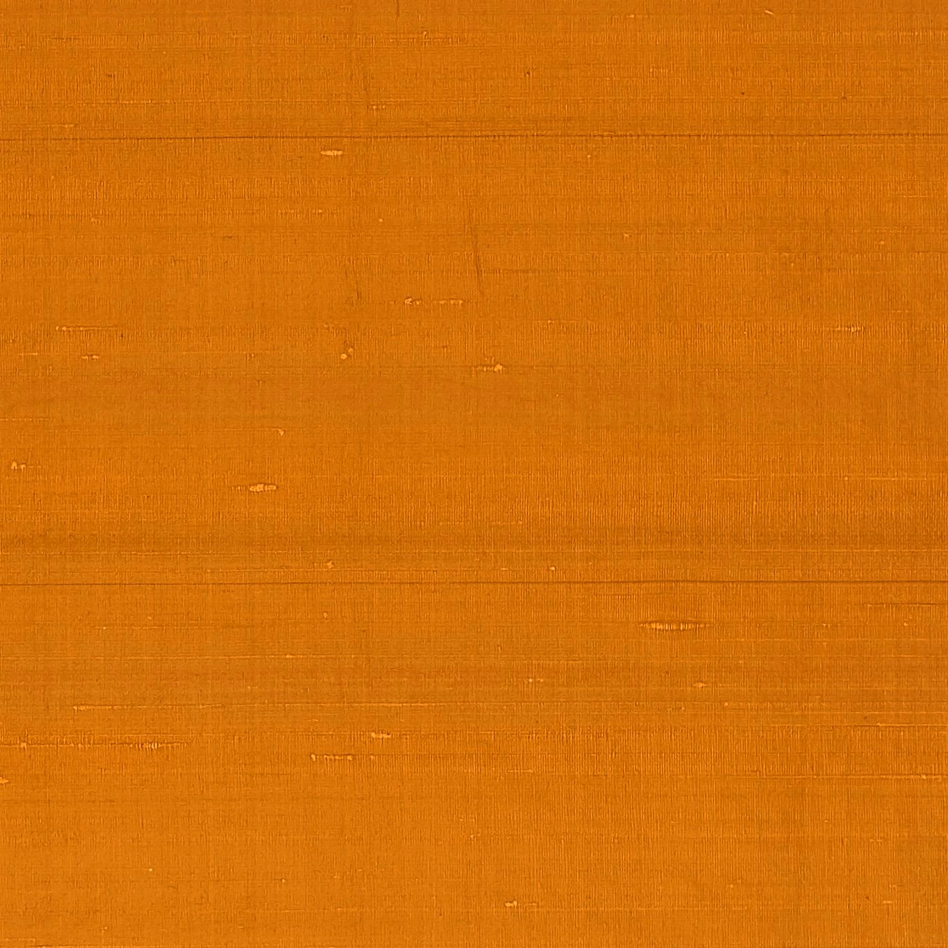 Burnt flame-orange plain weave with fine horizontal slubs and a softly textured surface
