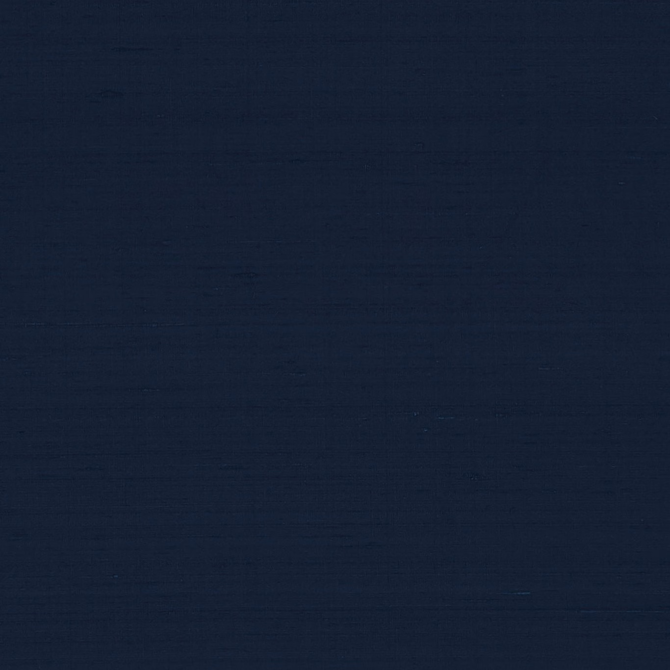 Close view of deep ink navy fabric with subtle horizontal woven texture