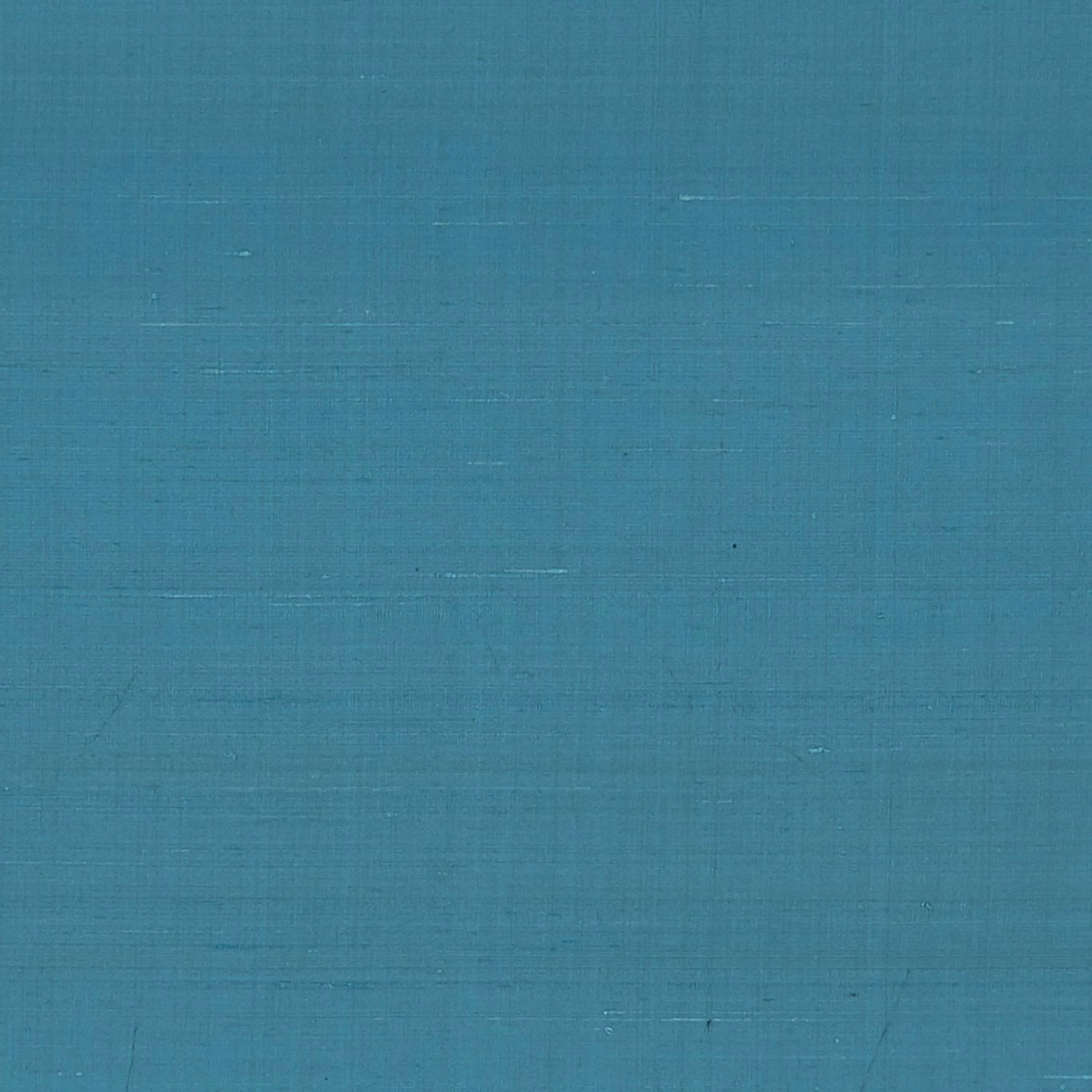 Close-up of storm-teal fabric with subtle horizontal and vertical woven texture
