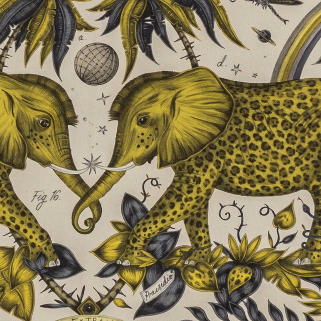 Olive-gold elephants and spotted leopard among charcoal botanicals on ivory fabric