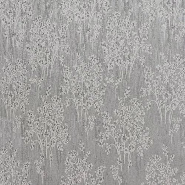 Soft seafoam grey botanical fabric with etched tree motifs on a textured ground